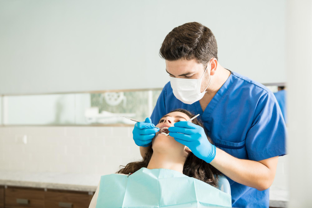 Patient receiving a routine dental examination at a dental clinic in Ras Al Khaimah to prevent serious oral health problems.
