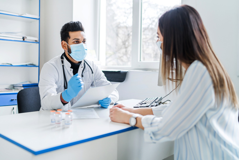 General Practitioner in Ras Al Khaimah consulting a woman about preventive healthcare.
